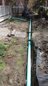 Green Pipe Installed — Northbrook, IL — Shelly’s Landscape 