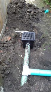 Green Pipe Installed In The Yard — Northbrook, IL — Shelly’s Landscape 