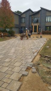 Man Install Brick — Northbrook, IL — Shelly’s Landscape 
