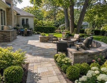 Residential landscape design with a curved paver walkway, structured planting beds and a mature Evanston Illinois home