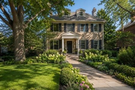Backyard transformation with patio seating, dining area, lush landscaping and privacy plantings in Evanston Illinois