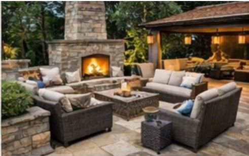 Luxury outdoor living space North Shore IL, natural stone patio, outdoor fireplace, outdoor kitchen, evening lighting, upscale backyard design Luxury outdoor living space North Shore IL, natural stone patio, outdoor fireplace, outdoor kitchen, evening lighting, upscale backyard design