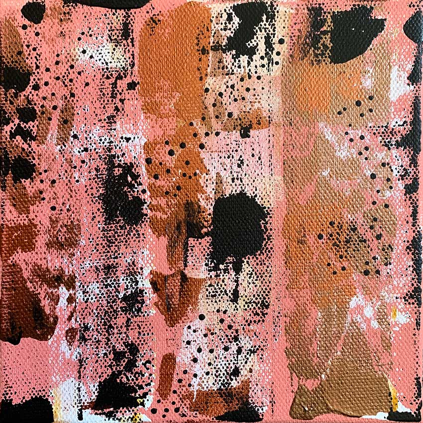 A close up of a painting on a canvas with a pink background and black spots.