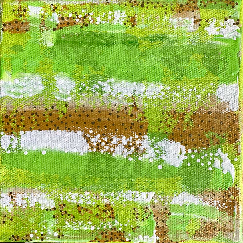A close up of a green and brown painting on a canvas.