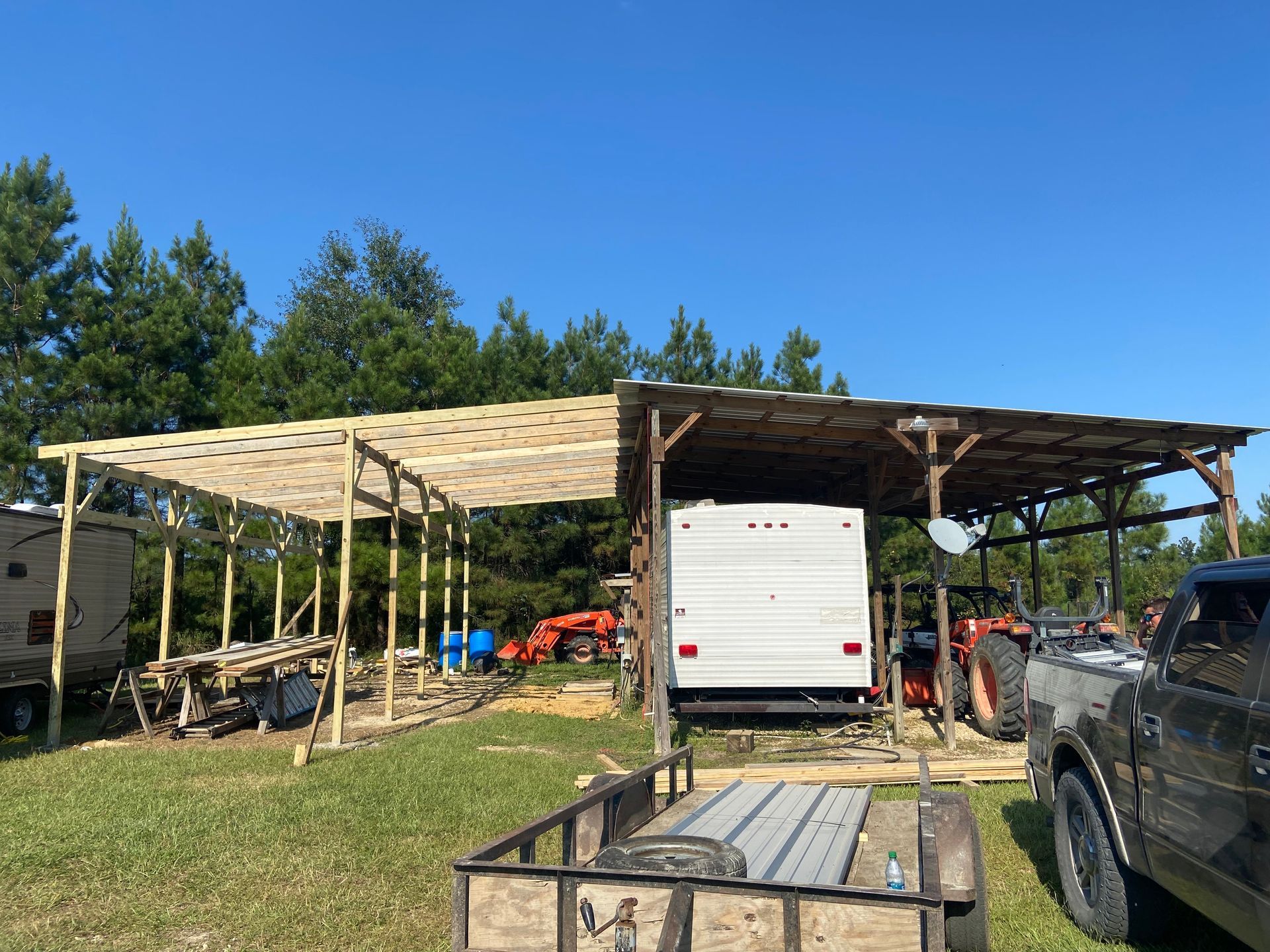 A truck is parked in front of a building under construction.