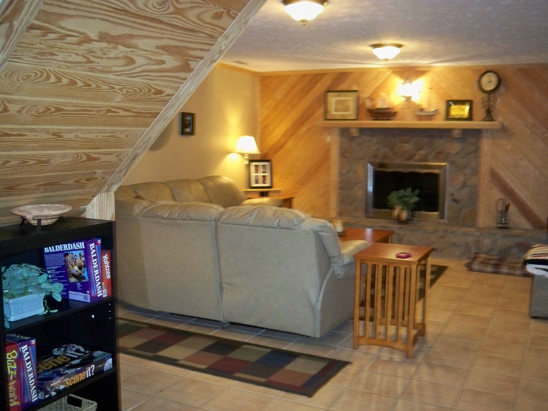 A living room with a couch and a fireplace