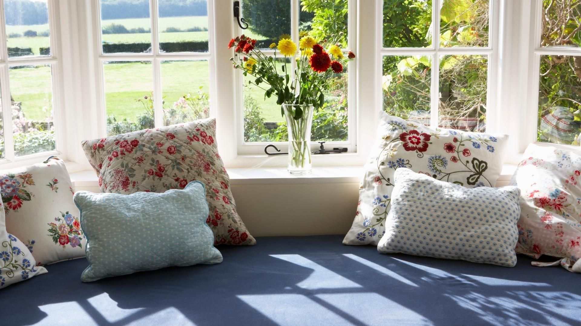 A kitchen with stainless steel appliances and white cabinets
