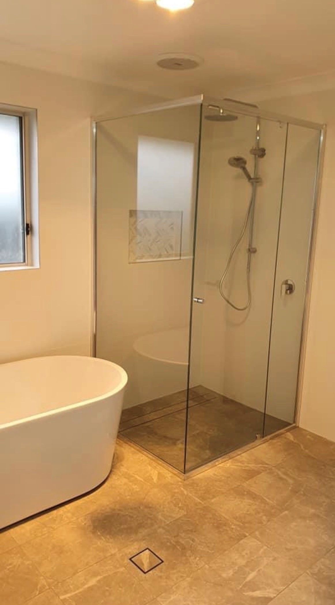 A Bathroom With a Bathtub and a Walk in Shower — Subat Plumbing Services in Kurri Kurri, NSW