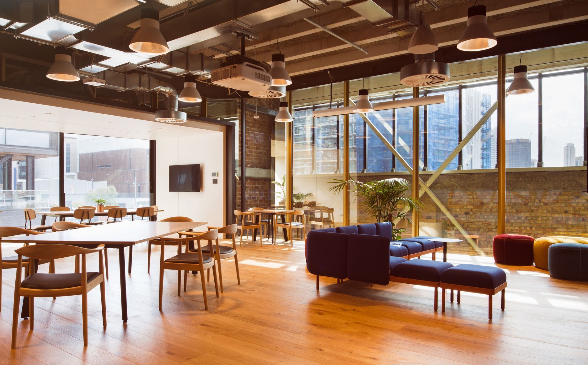 A large room with tables and chairs and a couch