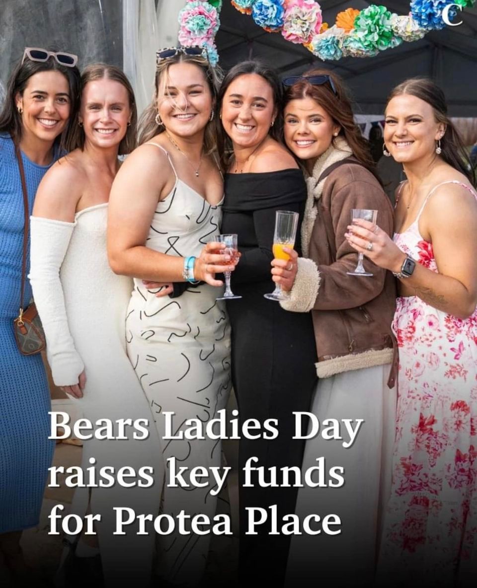 A group of women standing next to each other holding wine glasses with the caption bears ladies day raises key funds for protea place