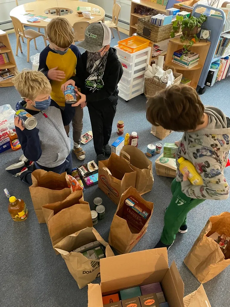 Montessori Children CollectingFood