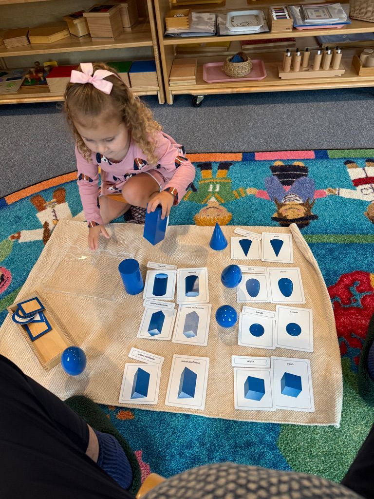 Montessori child working with math materials