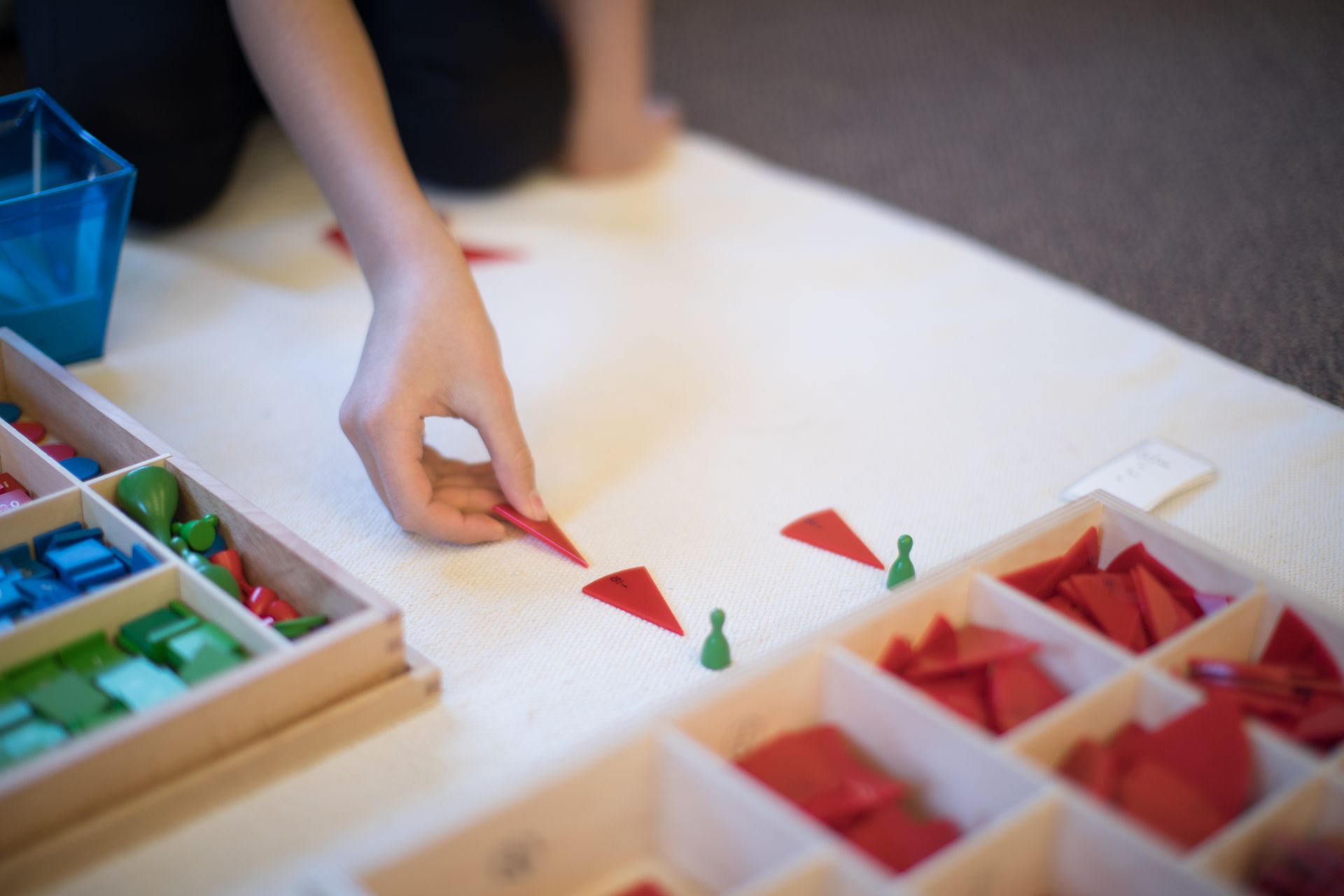 Montessori child working with math materials