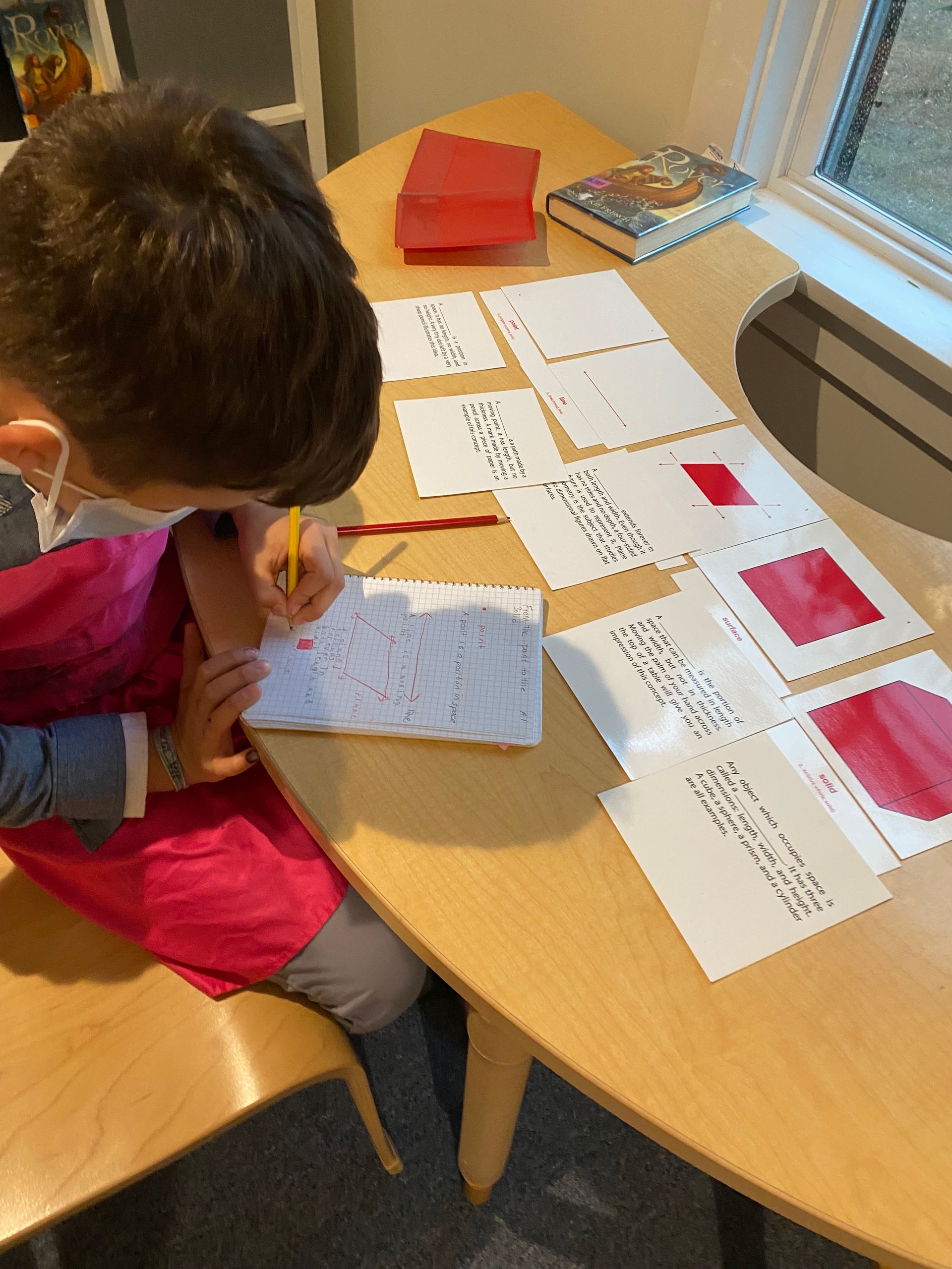 Montessori  child working on a graph