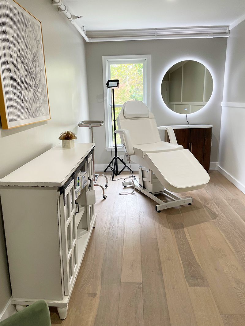 a room with a chair and a mirror in it for customized treatments