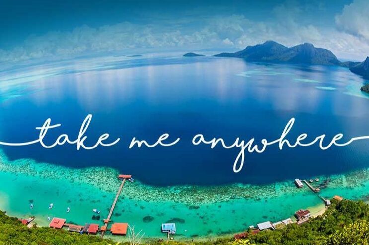 A picture of a lake with the words `` take me anywhere '' written on it.
