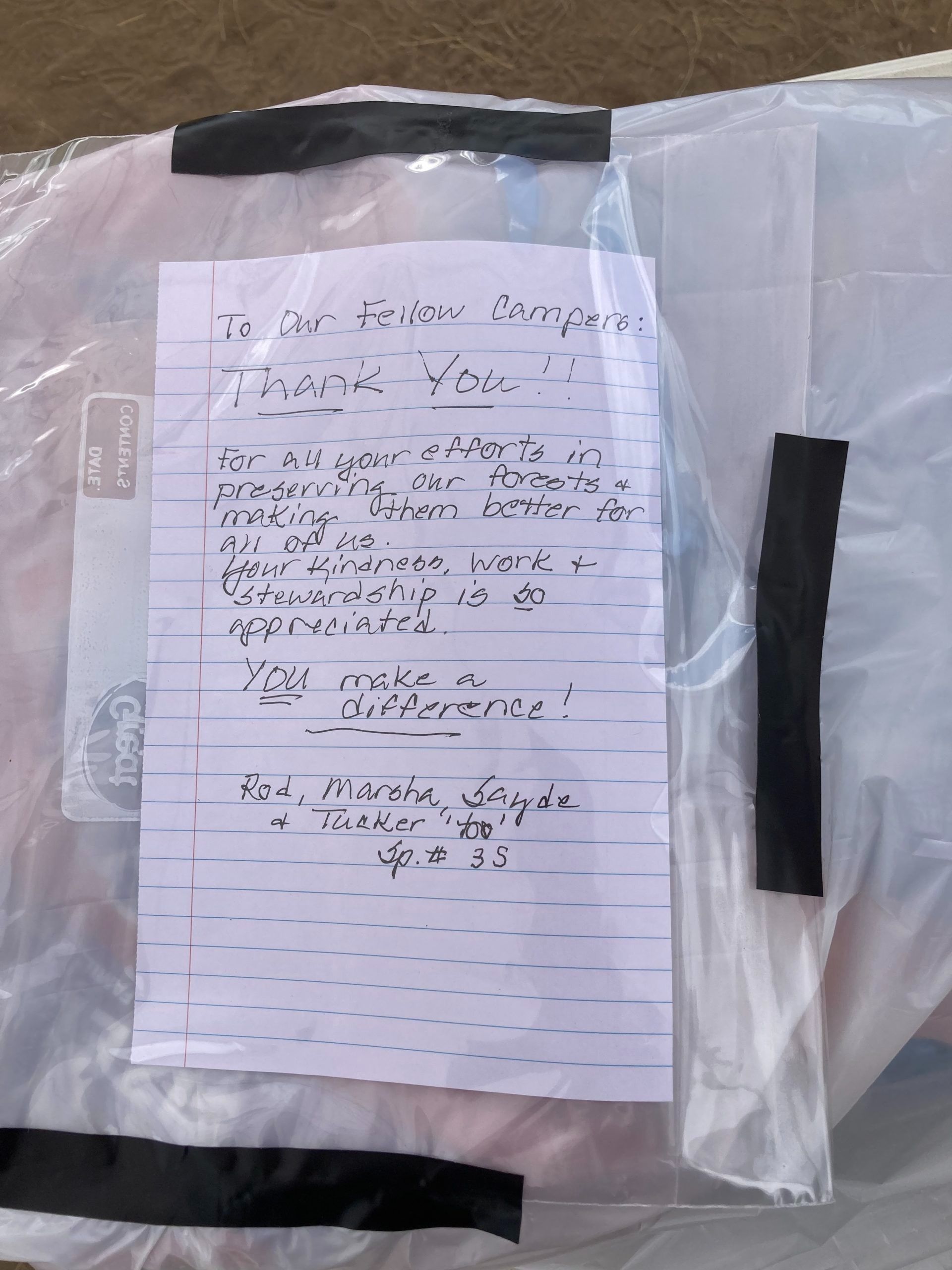 Photo of a note of appreciation left by the crew's camping neighbors.