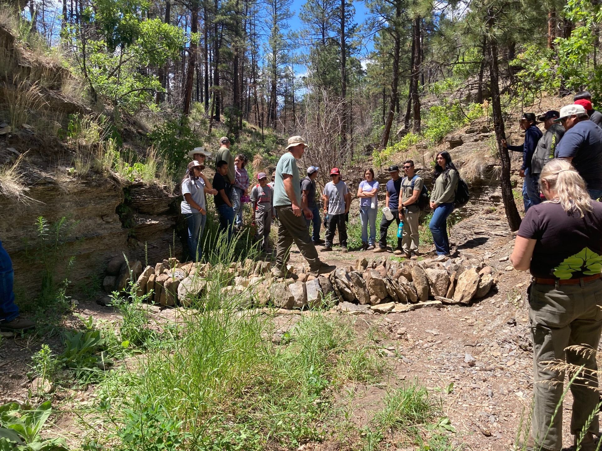 Photo of FSYC members learning about different restoration structures on site.