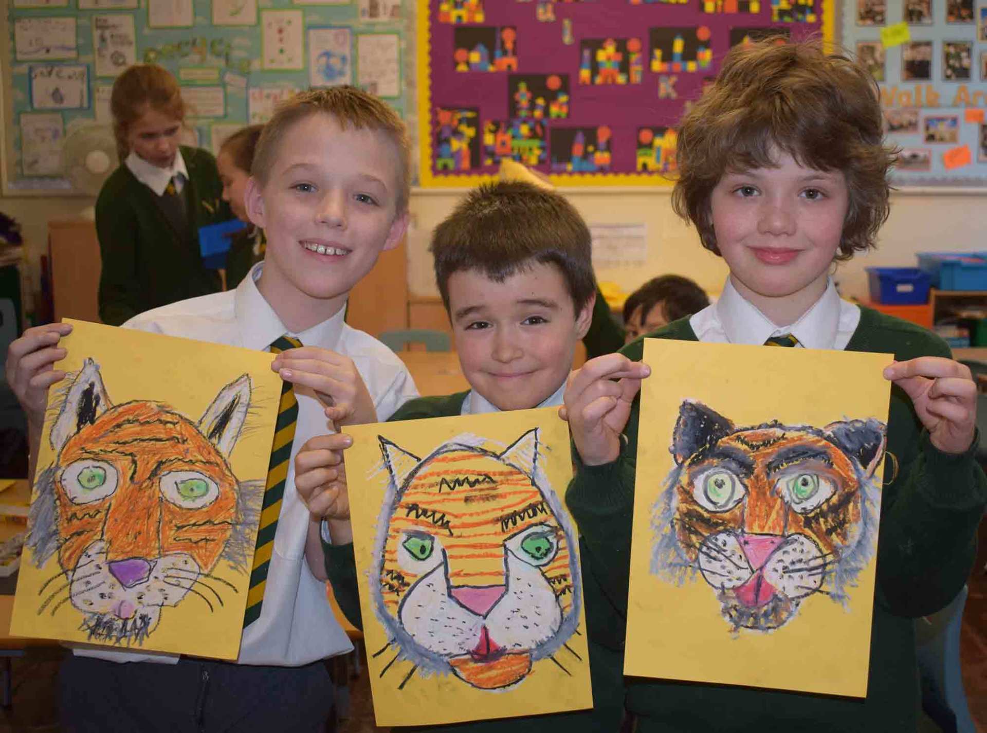 kids showing their tiger drawing
