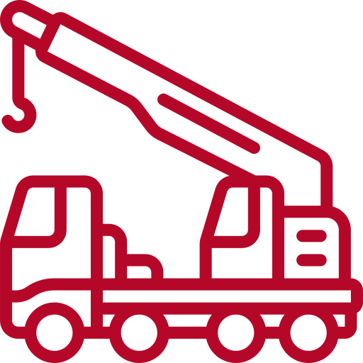 Red crane truck with raised boom and hook.