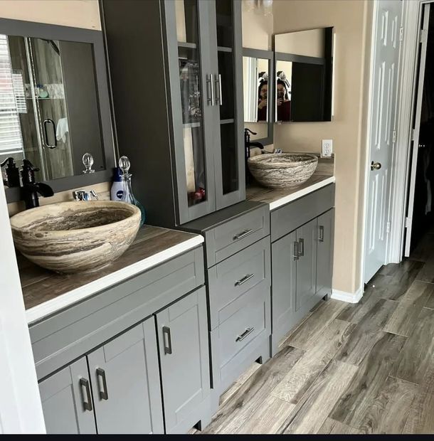 A bathroom with two sinks and a mirror