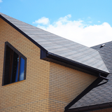 Michigan Wildlife Solutions - A brick house with a black roof and a window