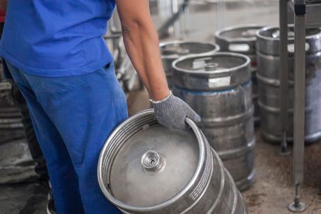 Genuine Bavarian wooden barrel is tapped