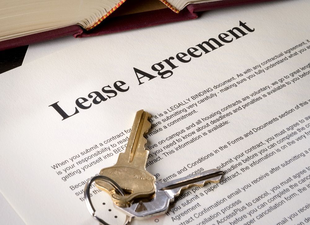 A Set of Keys Resting on a Printed Lease Agreement Document — Richardson Conveyancing In Newcastle, NSW