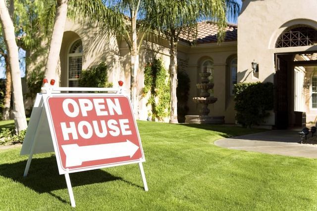 A Red Open House Sign Stands — Richardson Conveyancing In Tumbi Umbi, NSW