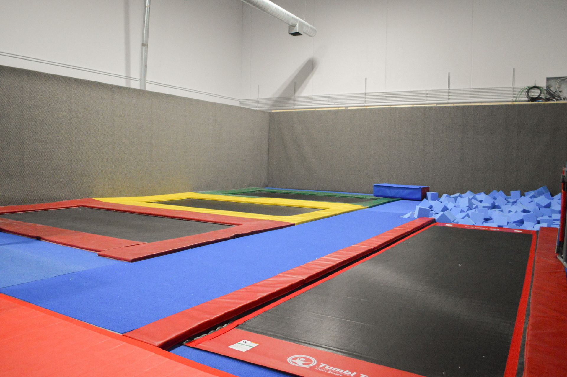 There are a lot of trampolines in this room.