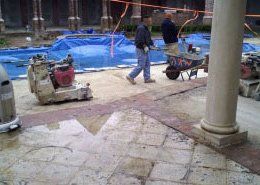 workers putting down concrete