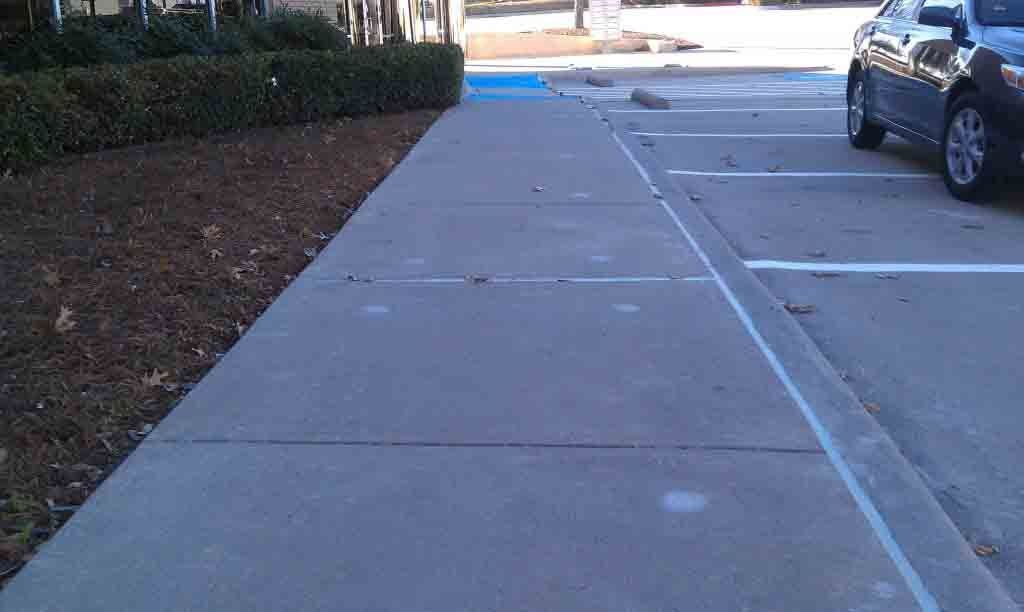 concrete walkway and parking lot