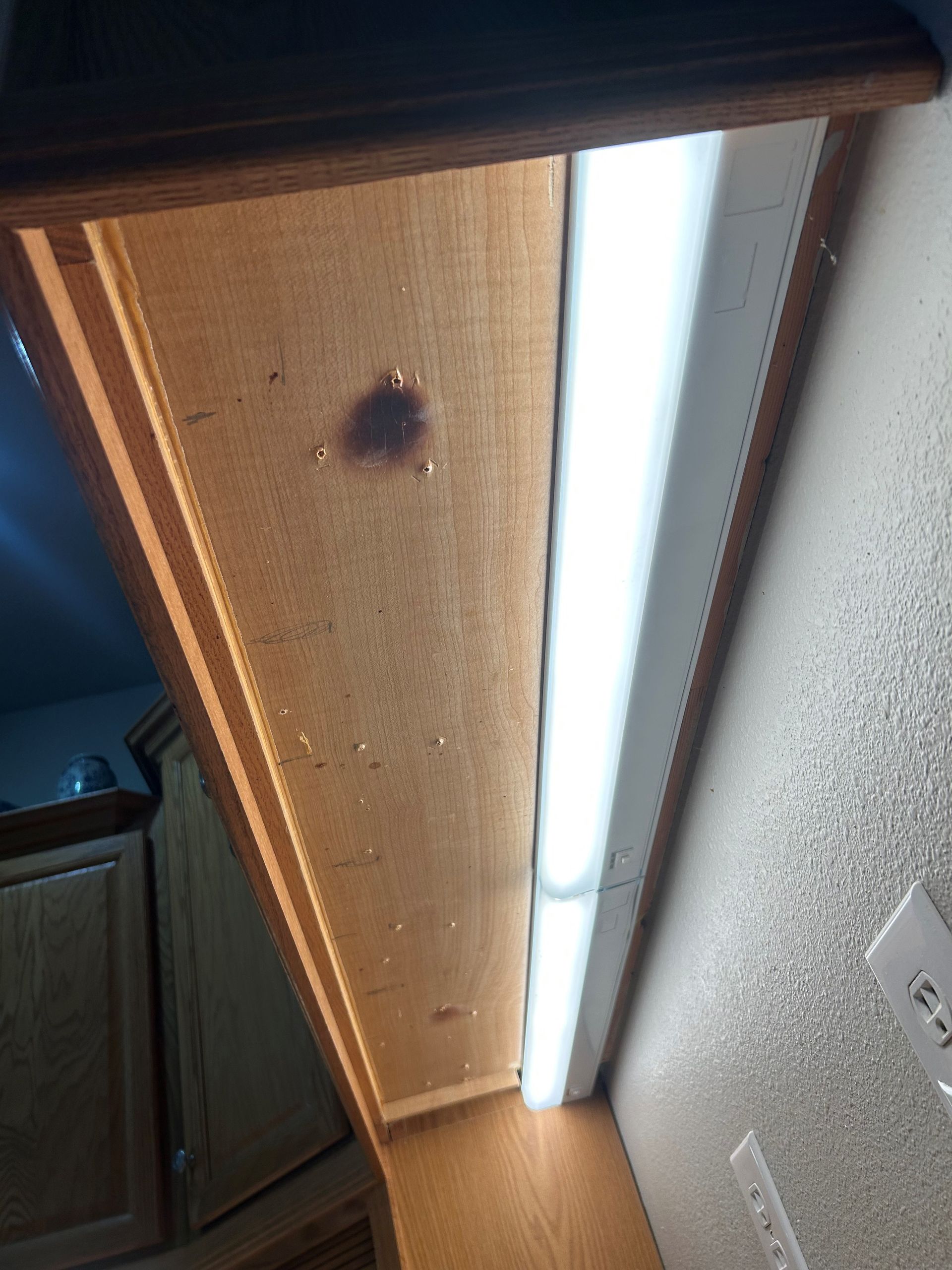 A light fixture is hanging from the ceiling of a room.