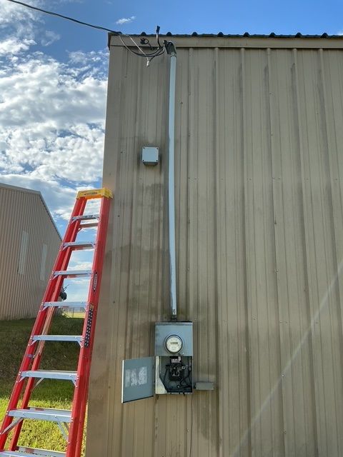A ladder is attached to the side of a building.