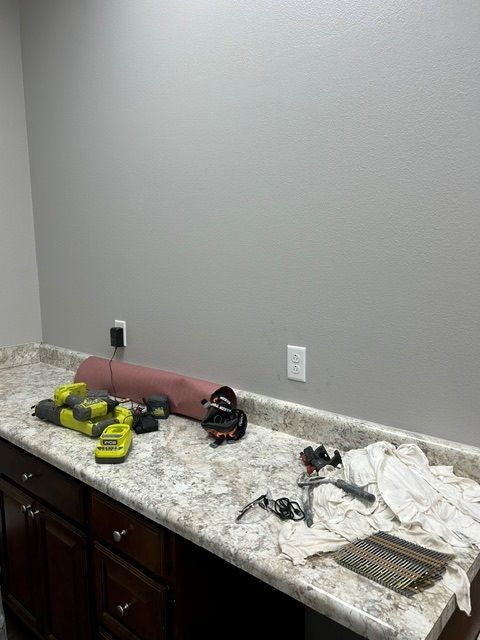 A kitchen counter with a lot of tools on it.
