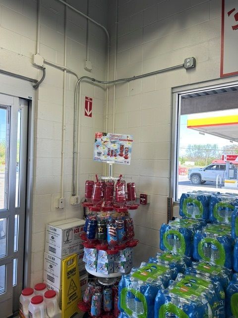 A store filled with lots of water bottles and cans.