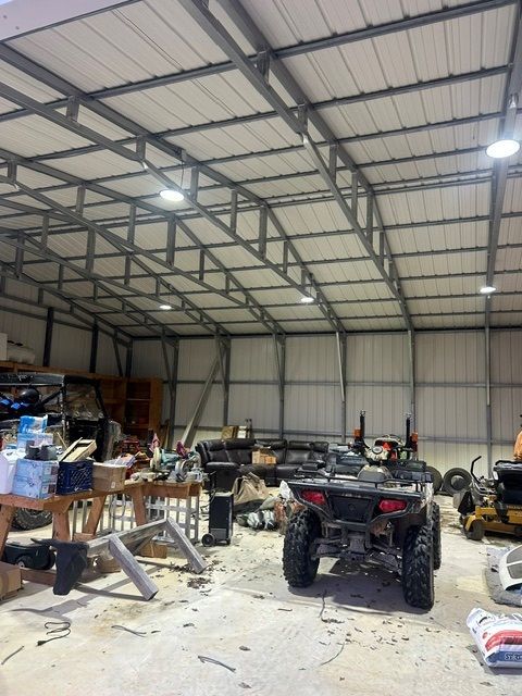 An atv is parked in the middle of a warehouse