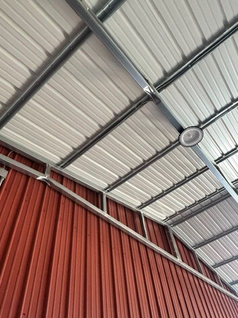 A ceiling fan is hanging from the ceiling of a building.