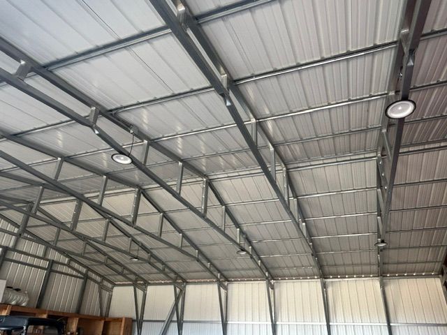 The inside of a building with a metal roof