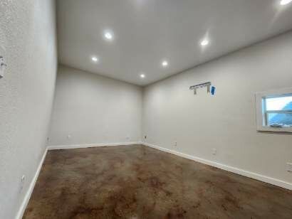 There is a window in the corner of the room.