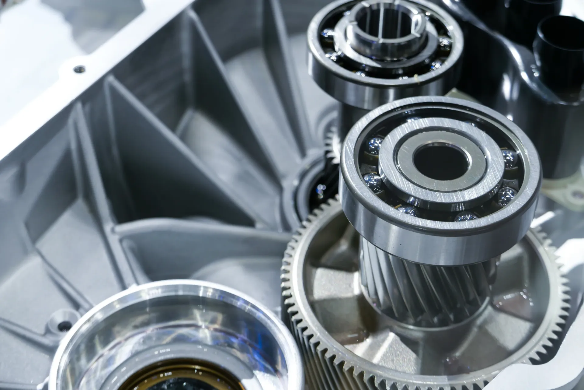 A high-angle view of mechanical gear components, ball bearings, and metallic casing parts inside a machine engine. — Murwillumbah Motor Wreckers in Byron Bay, NSW