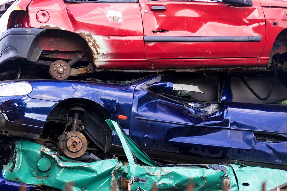 Stack of Three Salvaged, Wrecked Cars — Murwillumbah Motor Wreckers in Lismore, NSW