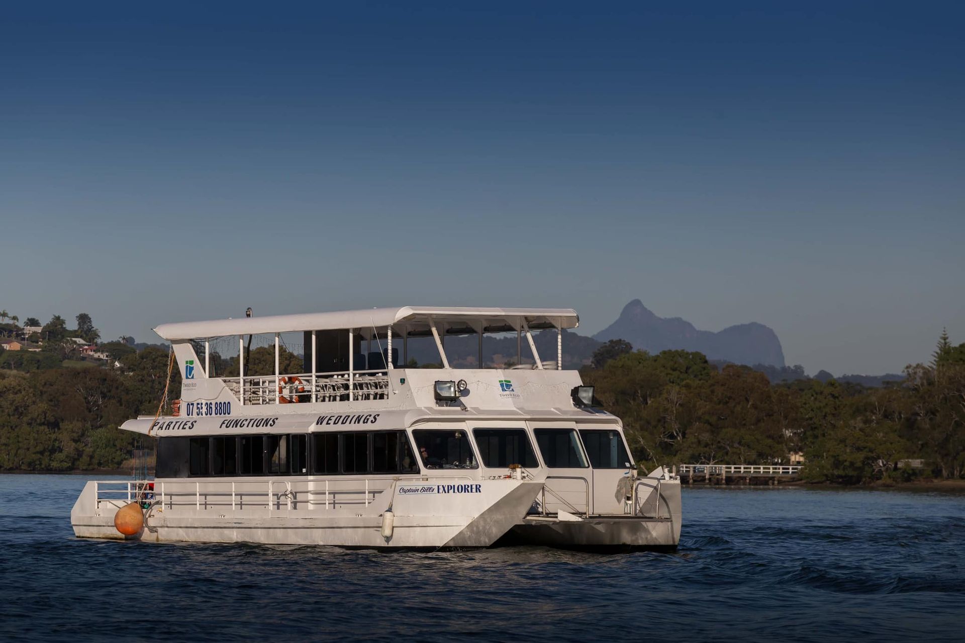 A large white boat is floating on a body of water