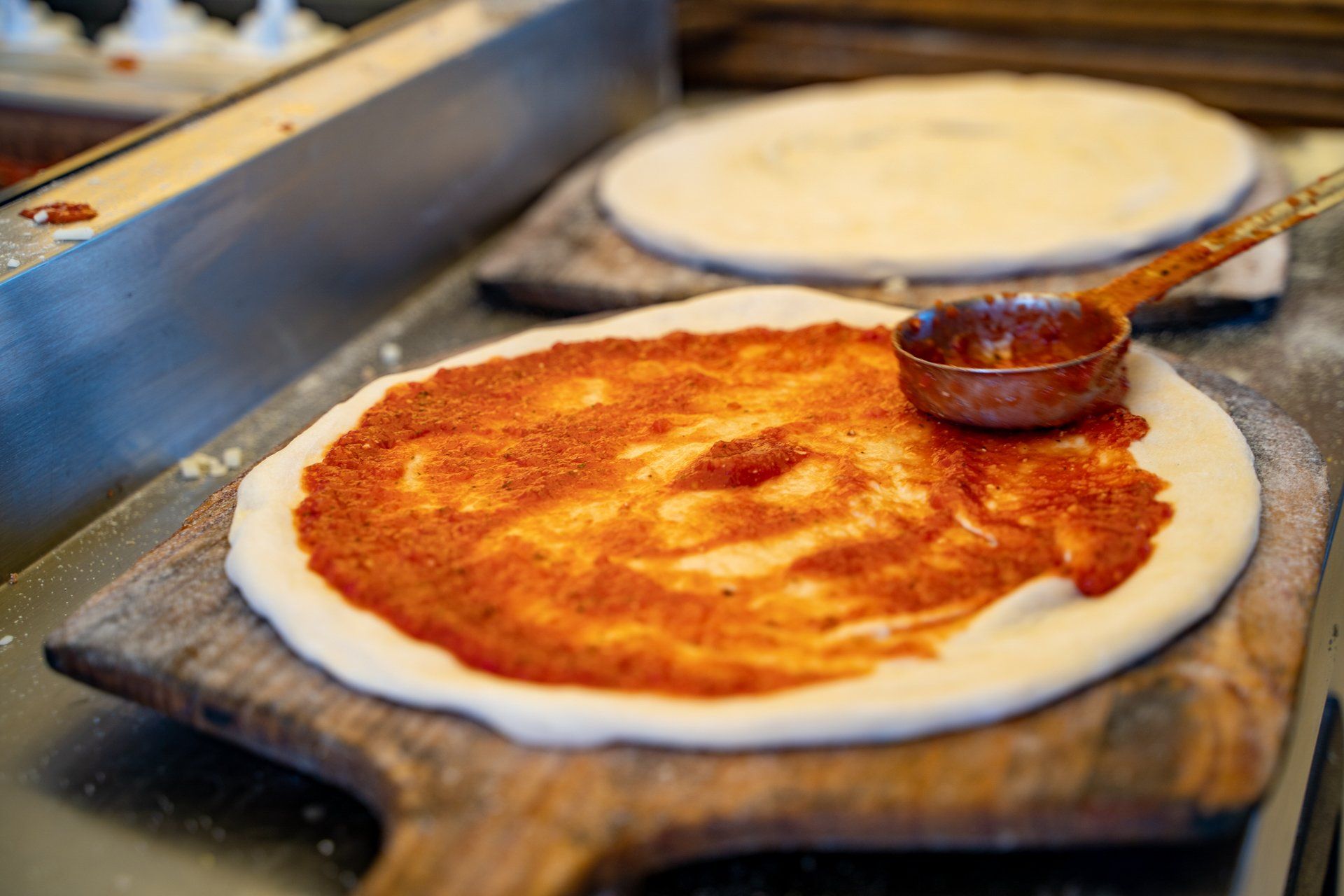 Dang Brother Pizza Camp Pendleton Spreading Pizza Sauce Photo