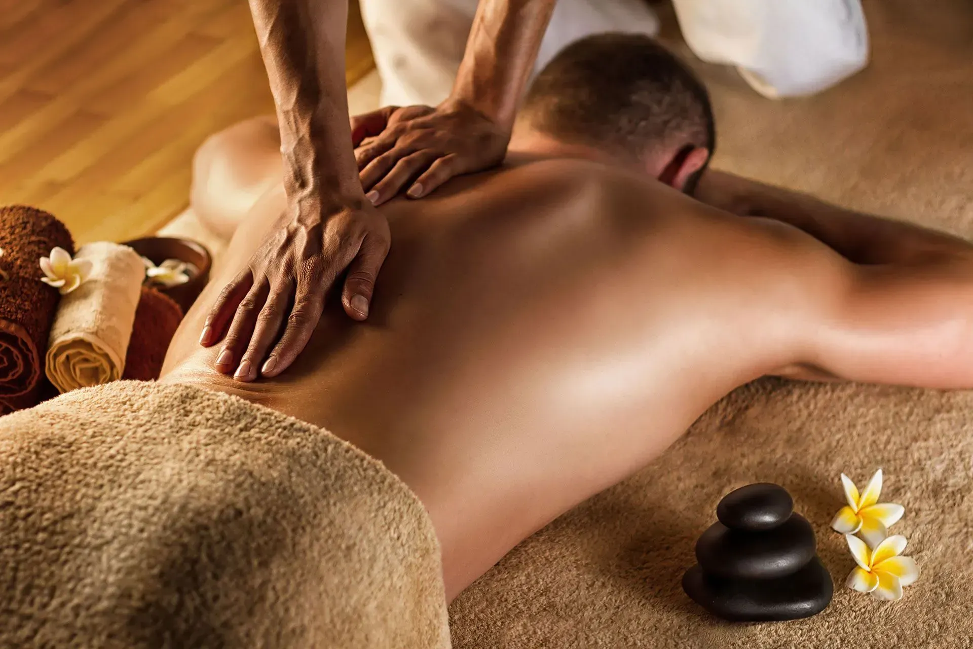 A man is getting a massage at a spa.