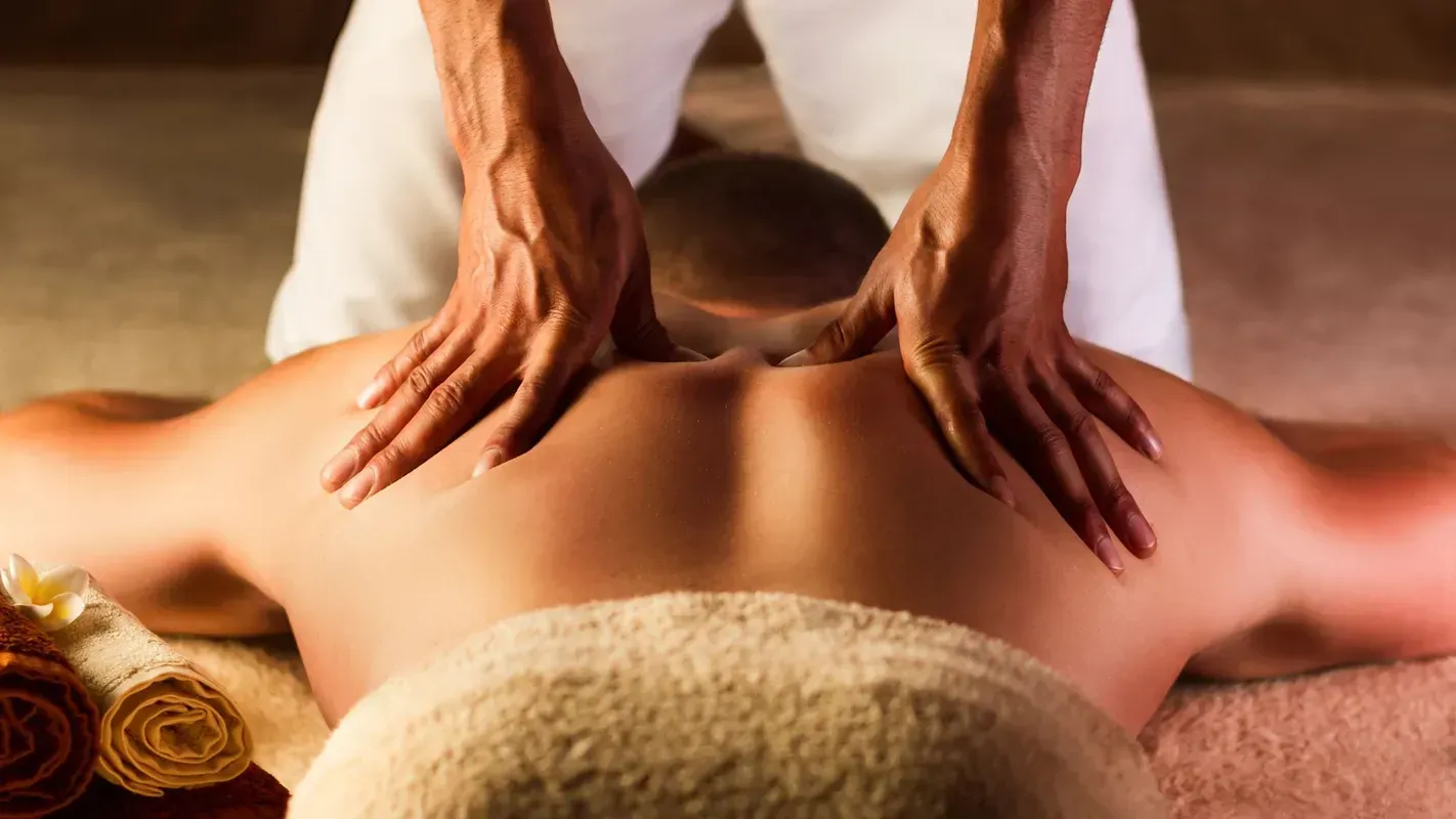 A man is getting a massage at a spa.
