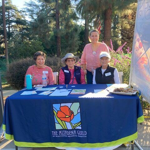 People at a table with a blue tablecloth for 
