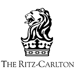 The ritz carlton logo is a black and white lion with a crown on its head.