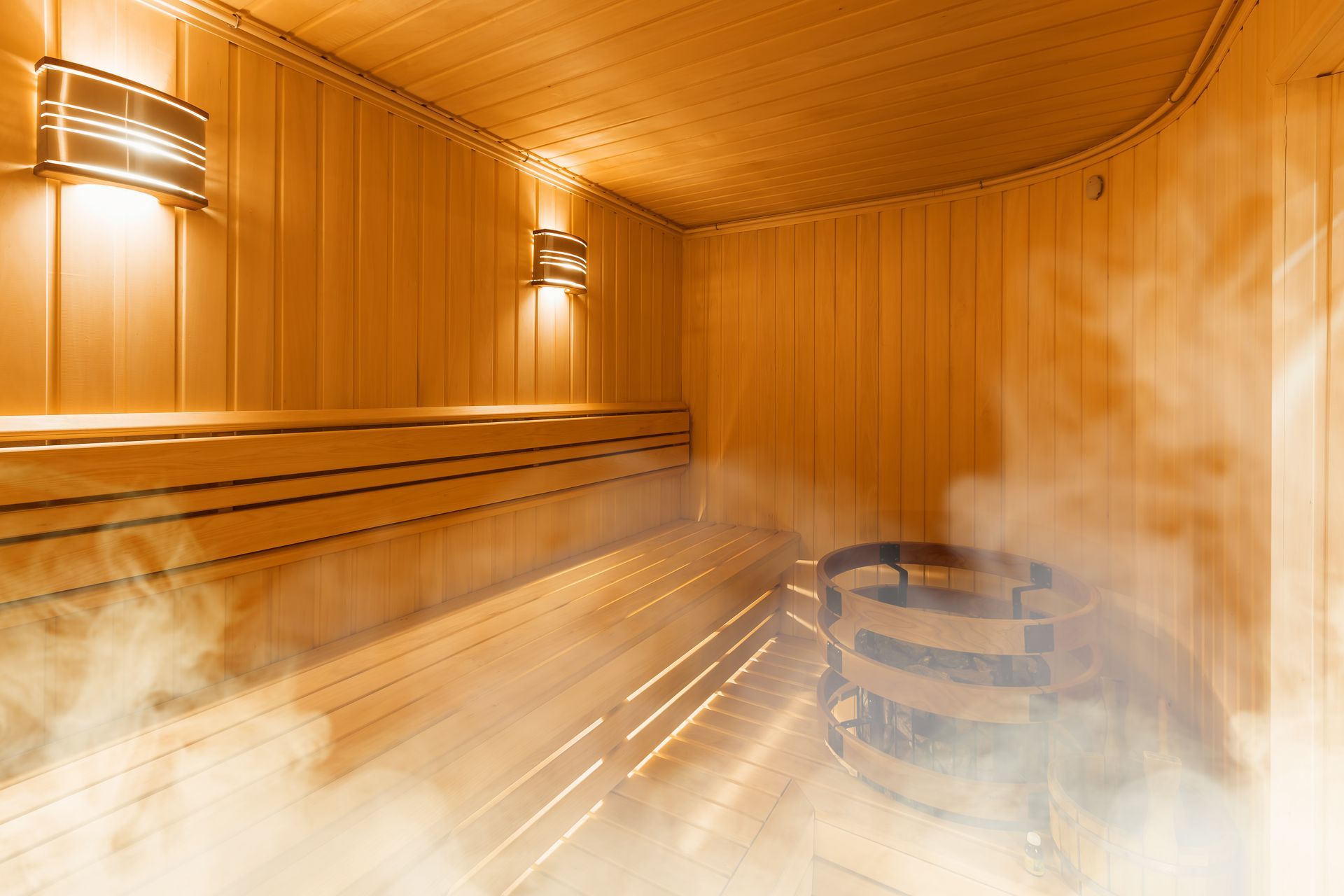 A wooden sauna with smoke coming out of it.