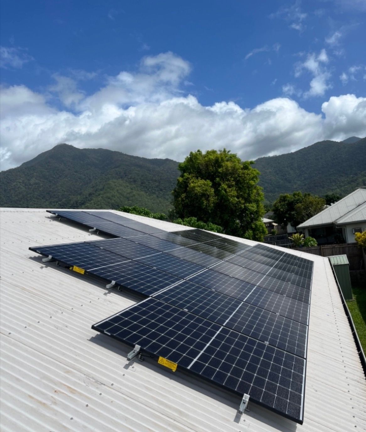 Solar Panels on a White Rooftop — Topspark Electrical FNQ in Bayview Heights, QLD